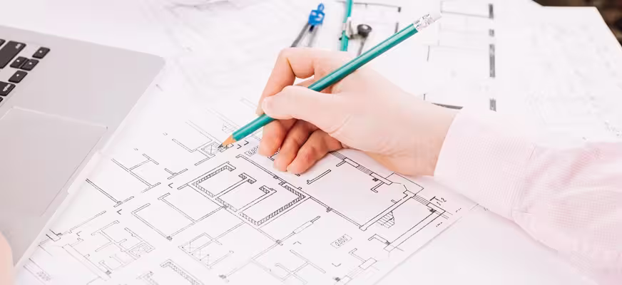 Engineers reviewing civil and structural design drawings for a construction project