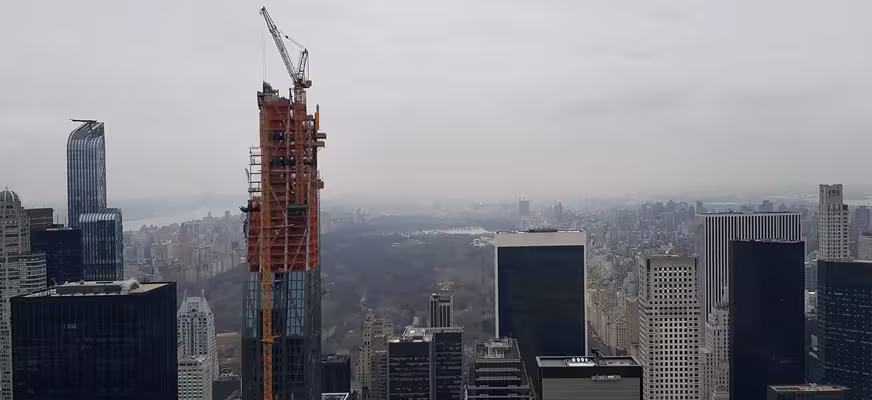 High-rise building under construction with structural and façade works in progress